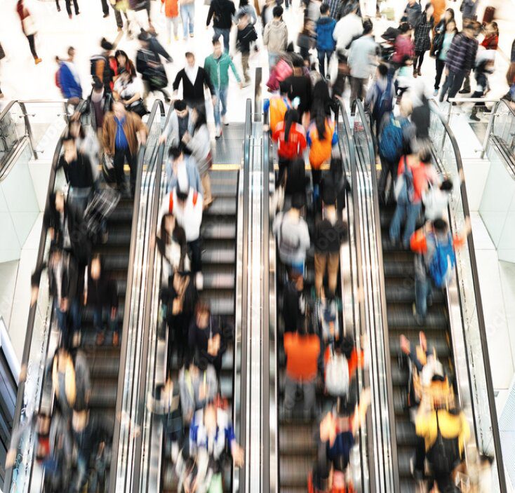 People walk in a shopping center